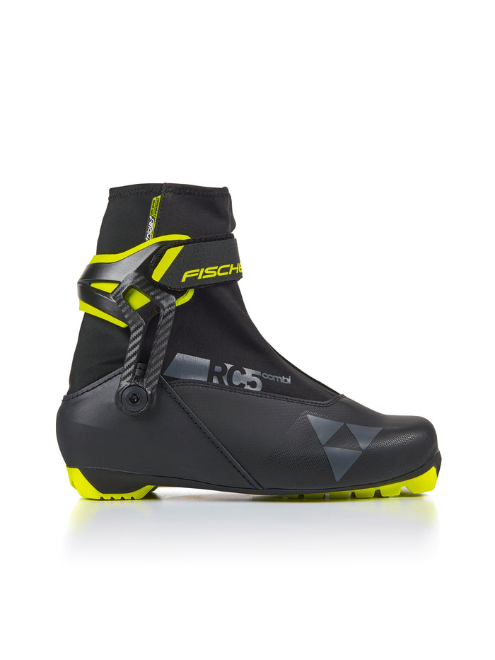 Cross-country ski boot with ankle strap, carbon fiber clasp, and neon yellow accents, side view