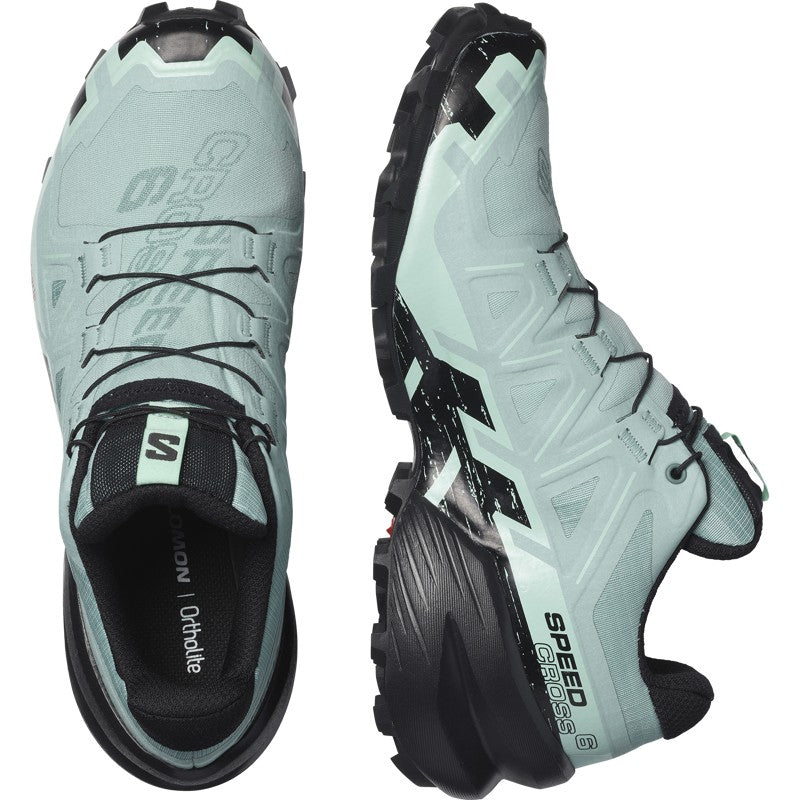 Trail running shoe shown from top and side angles, featuring aggressive lugged outsole and lace system