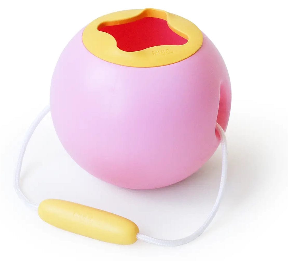 Pink and yellow bucket toy with carrying strap on white background