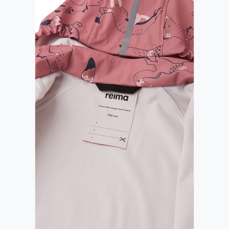 Children's rain jacket interior label detail showing hood with pink animal print and white lining