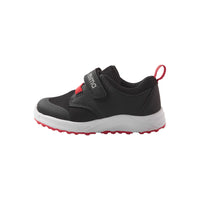 Black children's sneaker with velcro strap and red accents, side view profile
