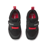 Black children's sneakers with velcro strap and red accent details, top view