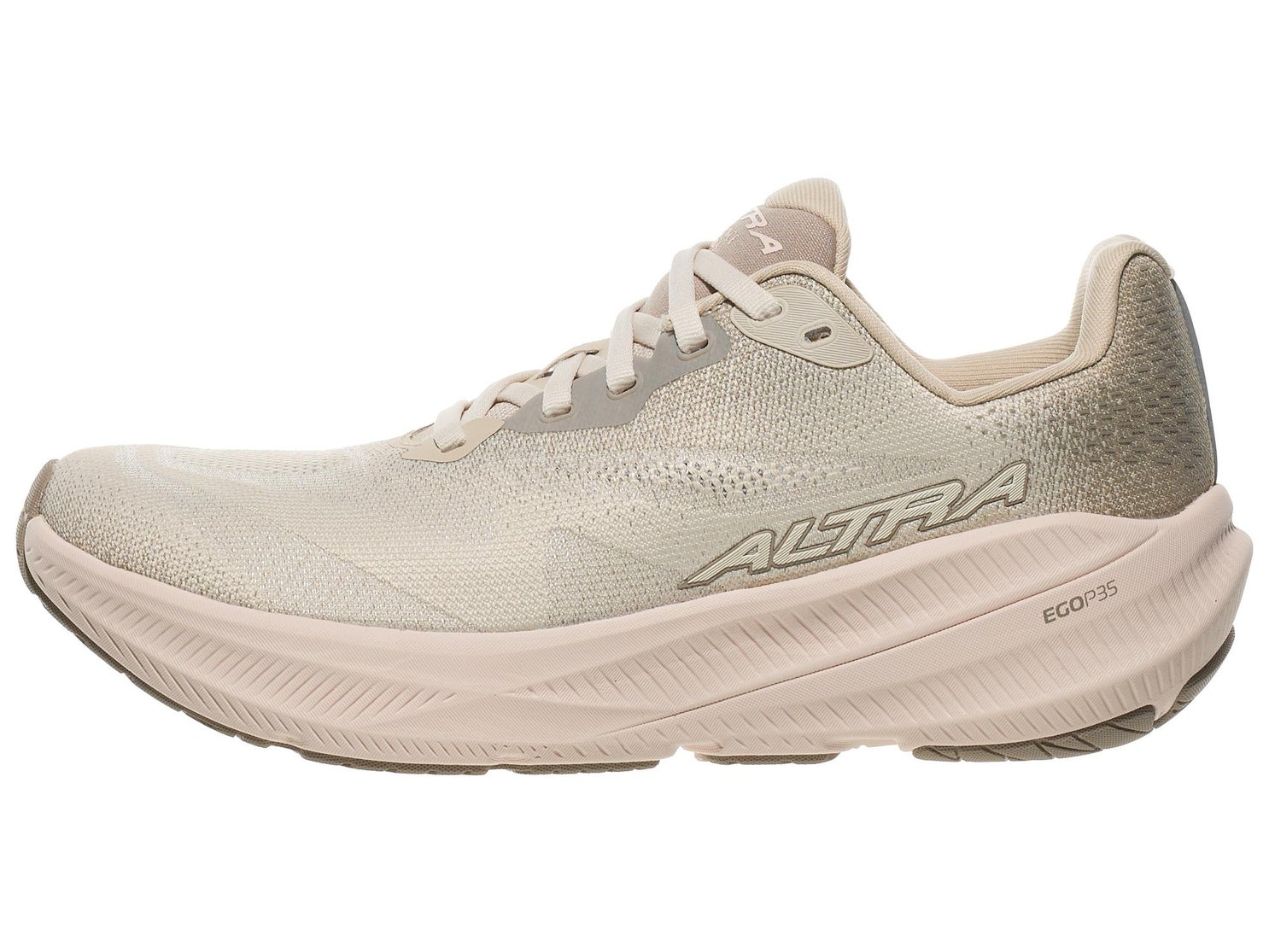 Light beige running shoe with mesh upper and thick curved sole, side profile view