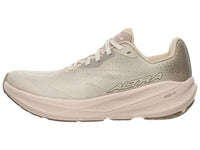 Light beige running shoe with mesh upper and thick curved sole, side profile view