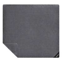Large two-person fleece blanket laid flat, showing quilted horizontal stitching and folded corner
