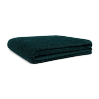Folded large two-person fleece blanket in deep teal with textured knit weave pattern