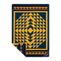 Throw blanket with geometric diamond pattern in navy blue and golden yellow, corner folded back