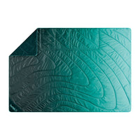 Quilted outdoor mat with curved wave pattern in gradient teal colors, flat lay view