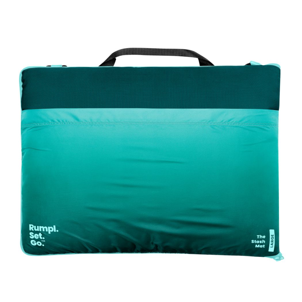 Rectangular outdoor mat with gradient teal to turquoise color and black carry handle