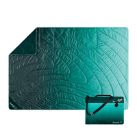 Quilted outdoor mat with gradient teal to green fade pattern and matching compact carrying case
