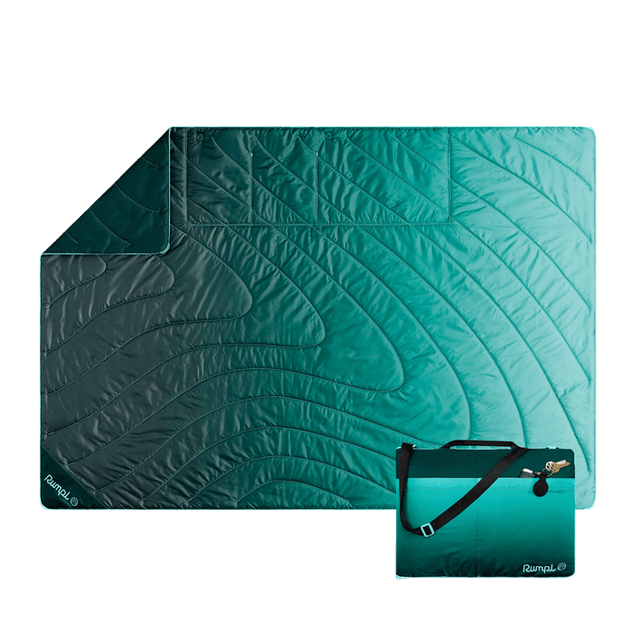 Quilted outdoor mat with gradient teal to green fade pattern and matching compact carrying case