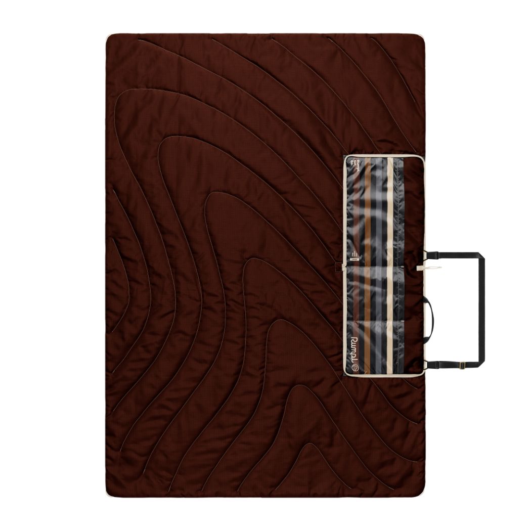 Brown quilted outdoor mat with striped pattern and carrying case, flat lay view