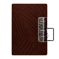 Brown quilted outdoor mat with striped pattern and carrying case, flat lay view