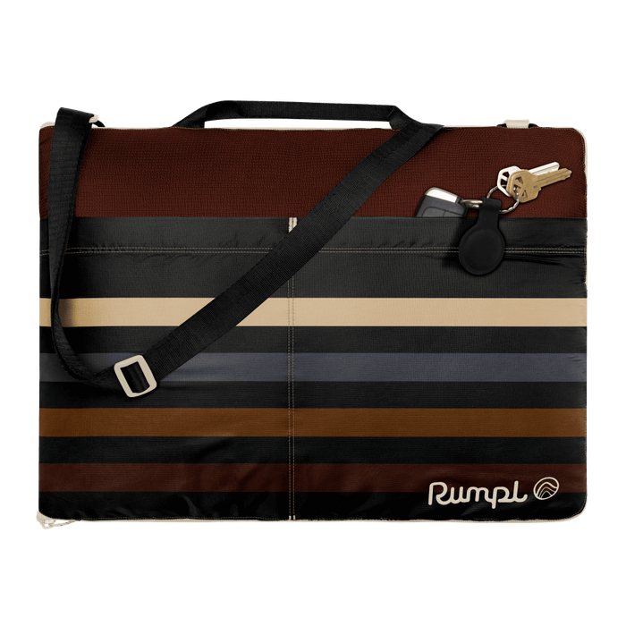 Striped blanket mat with shoulder strap and handle, featuring brown and neutral tones