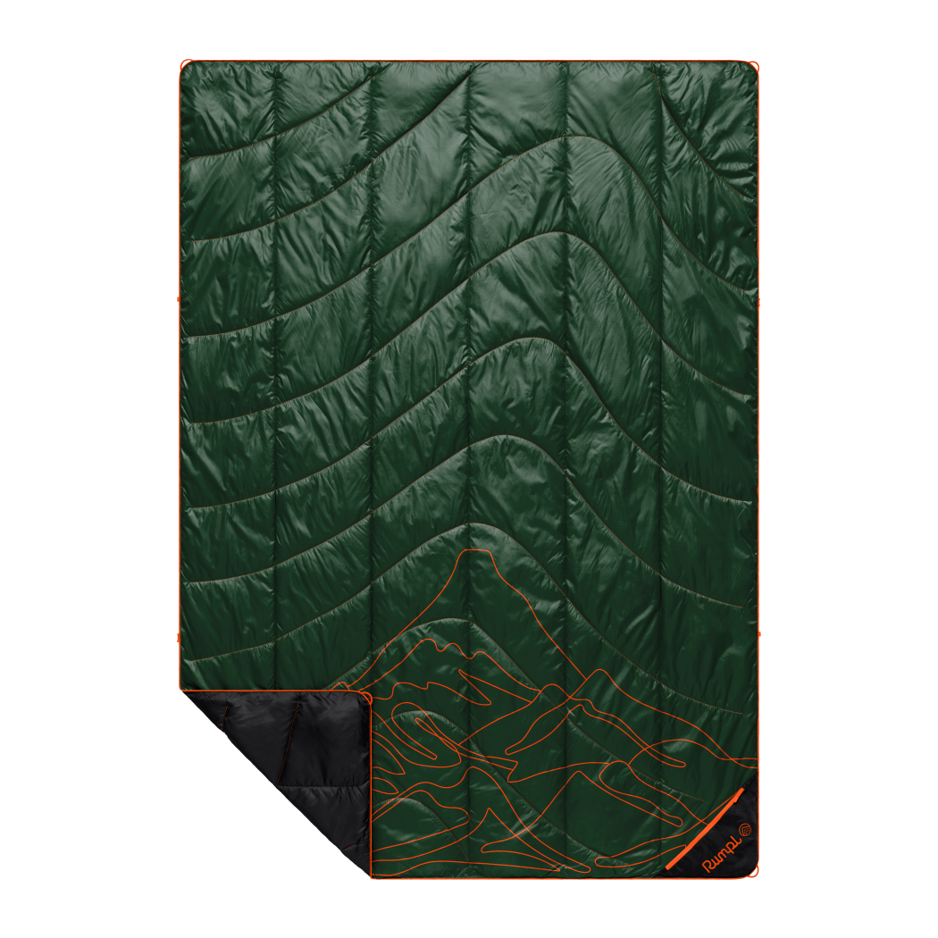 Green quilted outdoor blanket with orange mountain topographic pattern and black corner folded back