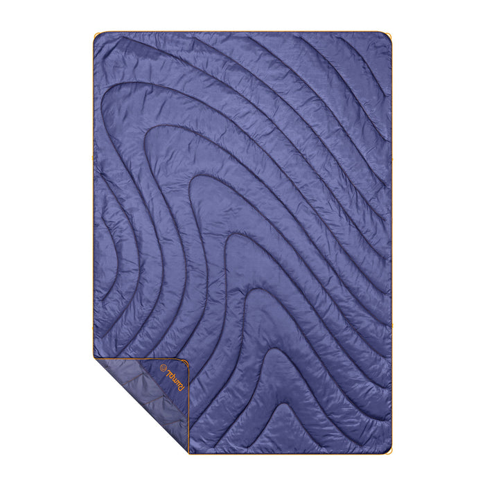 Purple quilted puffy blanket with curved stitching pattern laid flat, showing full rectangular shape