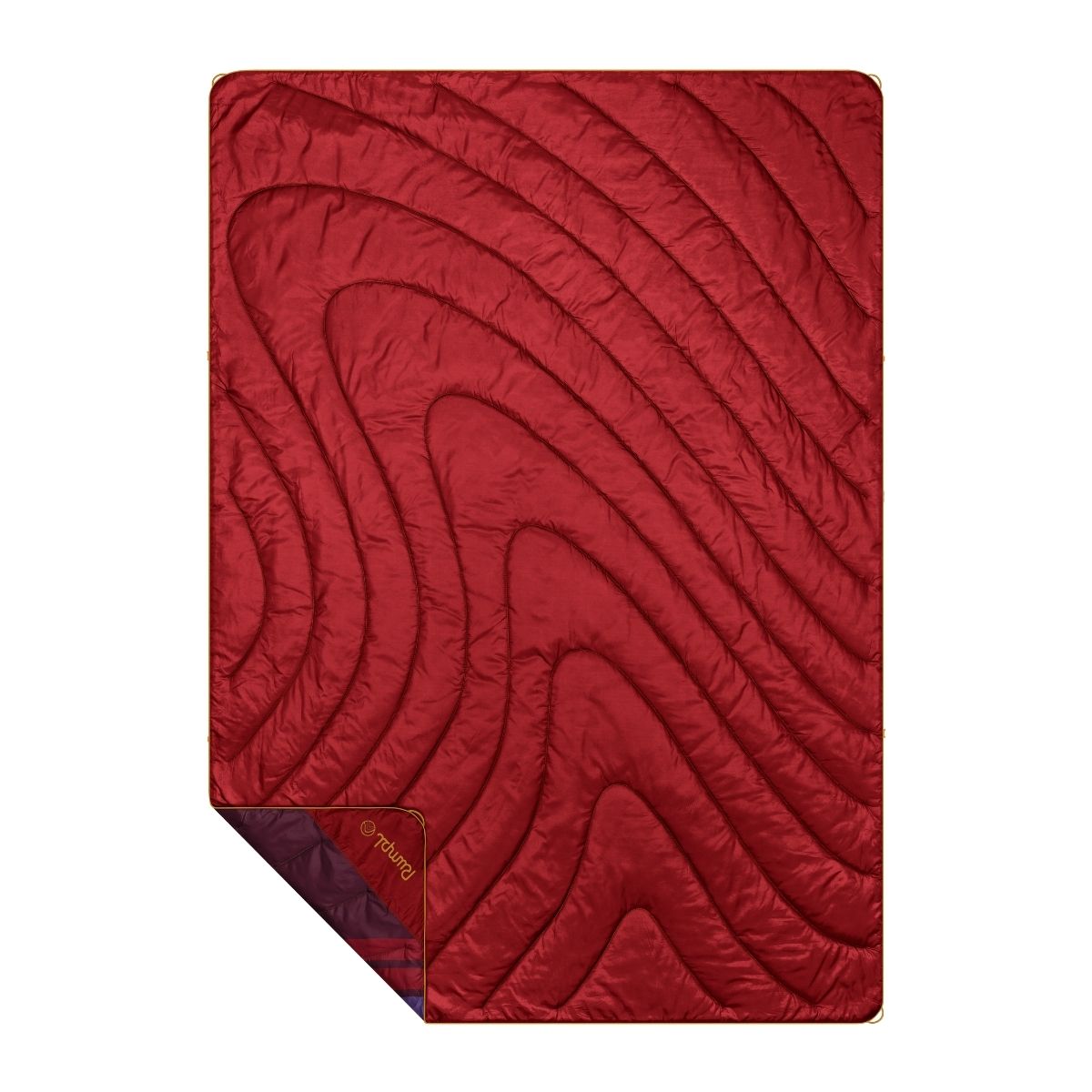 Red quilted puffy blanket with topographic swirl stitching pattern, corner folded to reveal purple reverse side