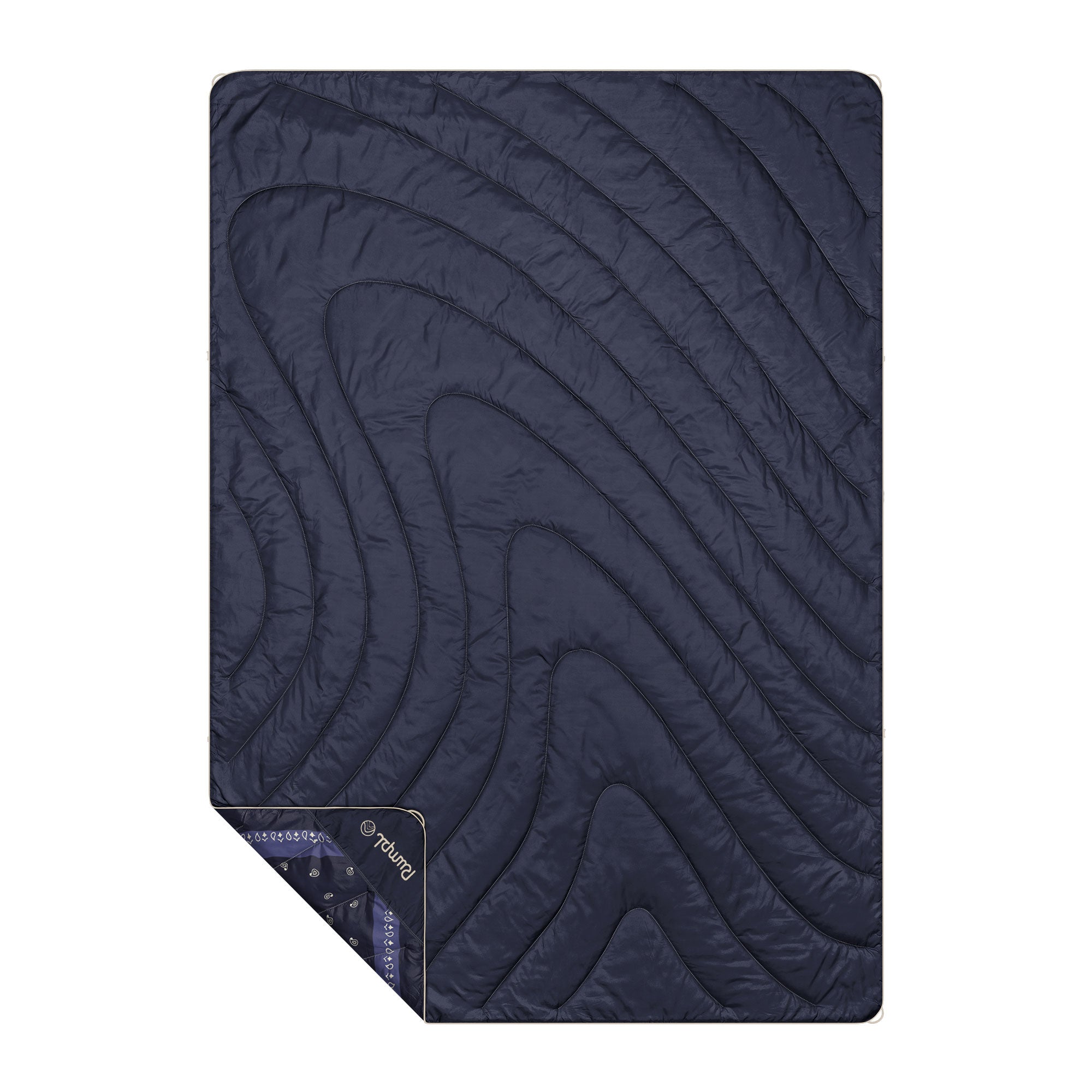Navy blue quilted puffy blanket with wave stitching pattern, corner folded to reveal printed lining