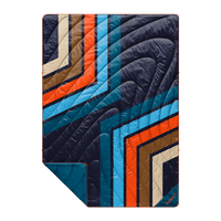 Quilted puffy blanket with bold retro geometric stripe pattern in navy, orange, blue, and brown