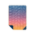 Quilted puffy blanket with sunset gradient ombre pattern, blue to orange, with navy reverse side