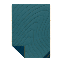 Quilted outdoor blanket with topographic swirl stitching, teal top and navy reverse, corner folded