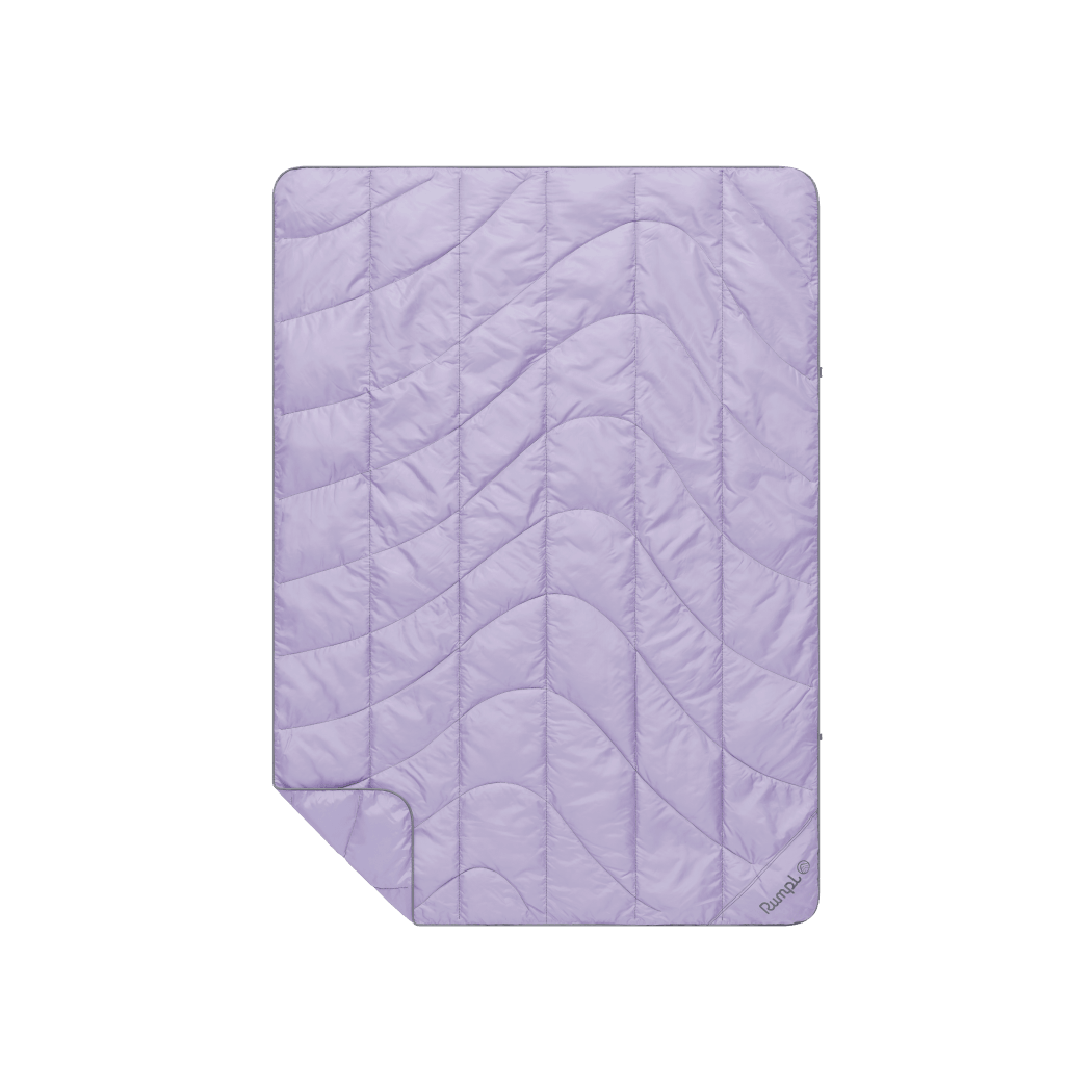 Light purple quilted travel blanket with wave stitching pattern, laid flat showing full size