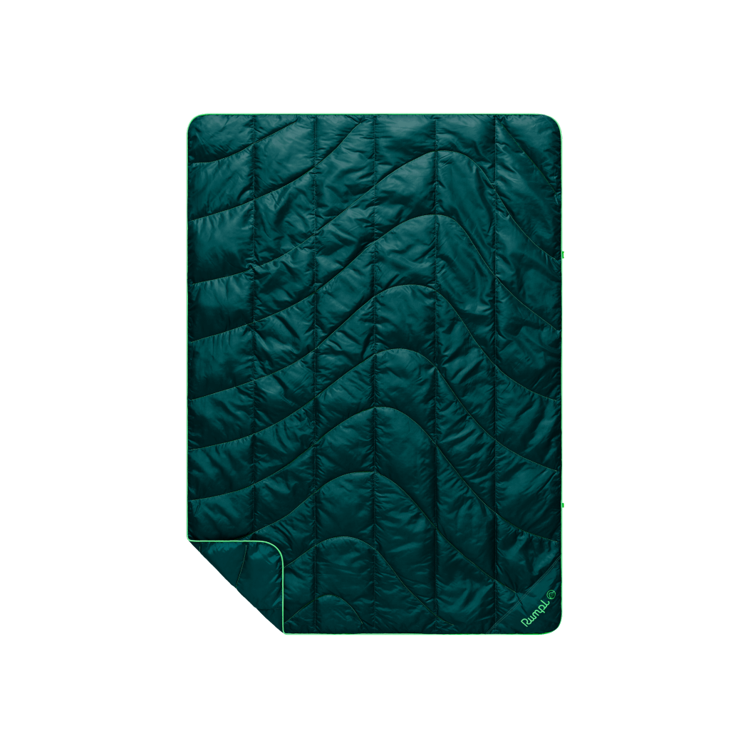 Dark teal quilted travel blanket with wave pattern stitching and bright green border trim