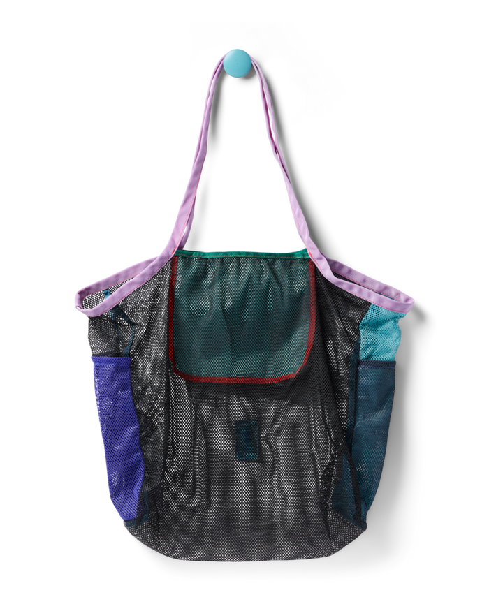Mesh tote bag with colorful fabric panels and purple shoulder straps, front view