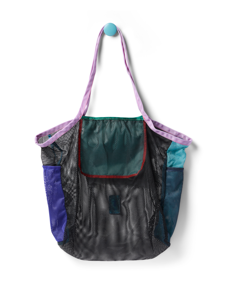 Mesh tote bag with colorful fabric panels and purple shoulder straps, front view