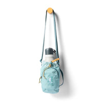 Light blue water bottle sling bag with crossbody strap, drawstring closure, and white insulated bottle