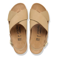 Light tan leather sandals with crossed straps and cork footbed, top view