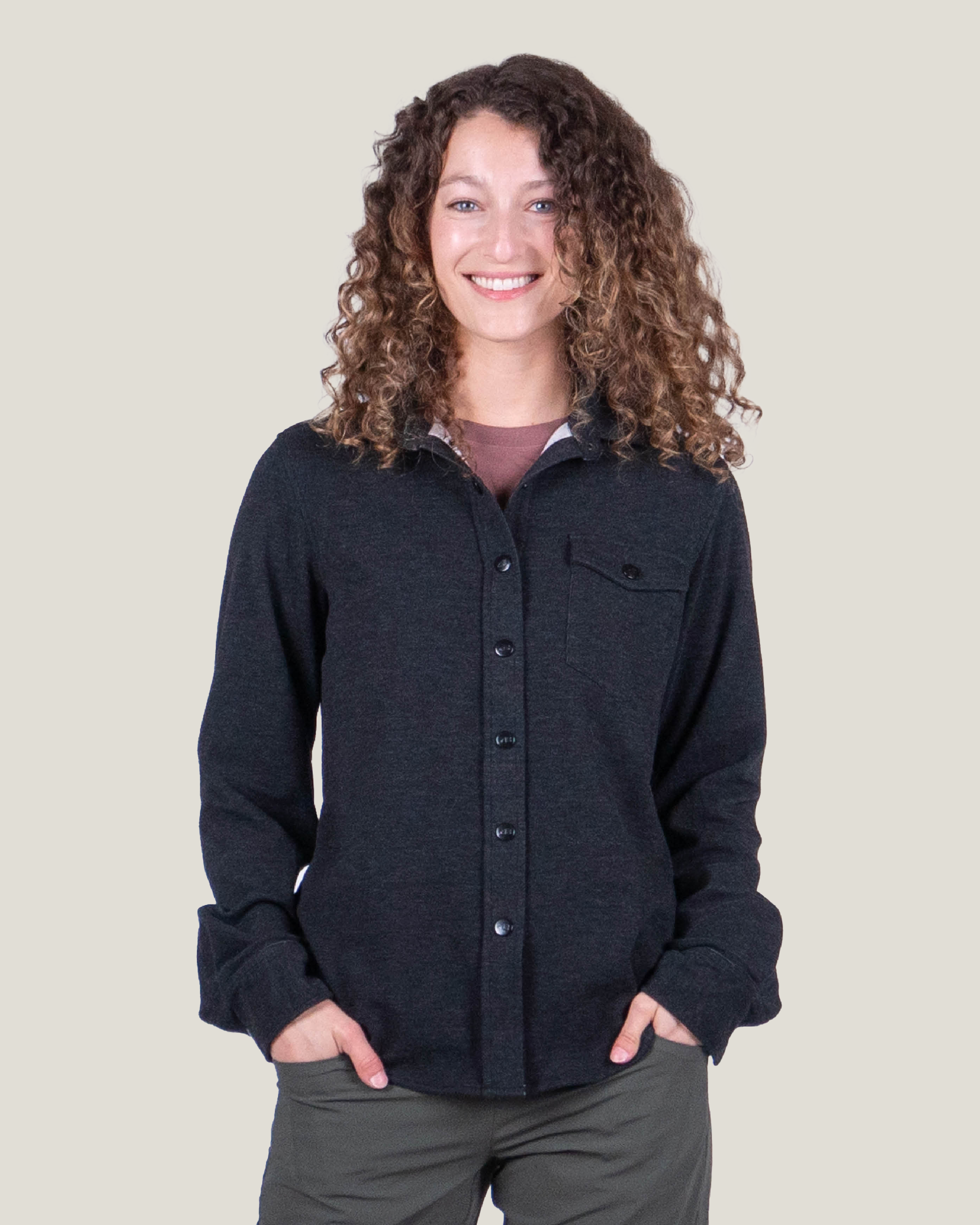 Women's fleece button-up shirt in dark charcoal, front view, with chest pocket and button placket
