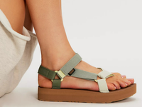 Platform sandals with adjustable fabric straps in green tones on brown sole