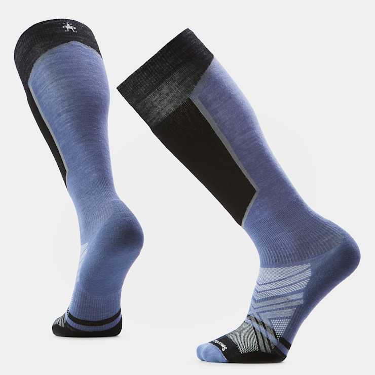 Over-the-calf ski socks in blue and black, shown from front and back angles