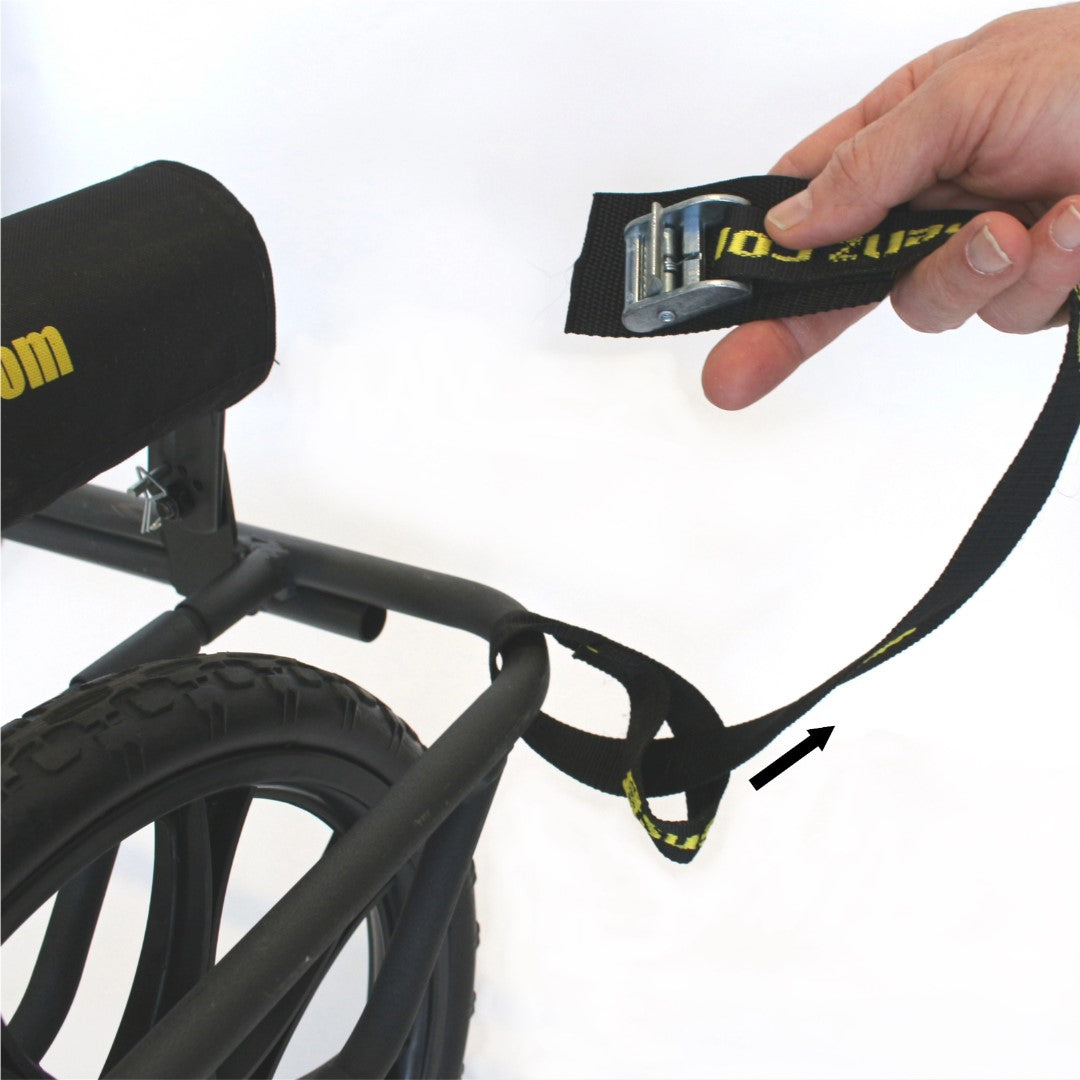 Hand securing strap on black wheeled cart with airless tires and adjustable frame