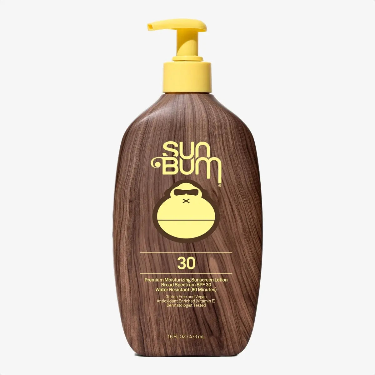 Brown wood-textured sunscreen lotion bottle with yellow pump dispenser, front view showing SPF 30 label