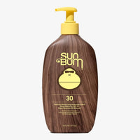 Brown wood-textured sunscreen lotion bottle with yellow pump dispenser, front view showing SPF 30 label