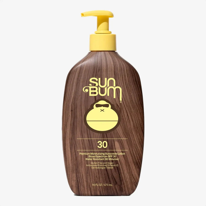 Brown wood-textured sunscreen lotion bottle with yellow pump dispenser, front view showing SPF 30 label