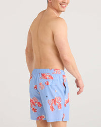 Men's swim shorts in light blue with red lobster print, back view on model