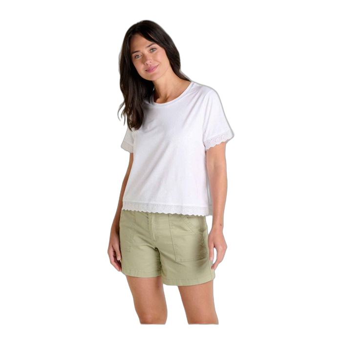 White short-sleeve tee with lace trim details on sleeves and hem, worn with green shorts