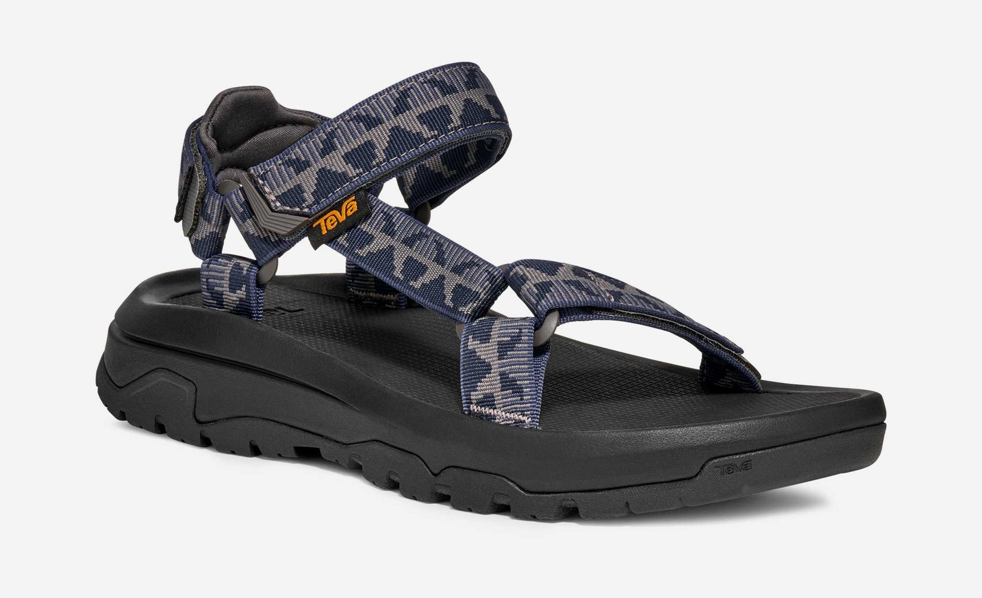 Outdoor sport sandal with navy grey camouflage straps and black sole, side angle view