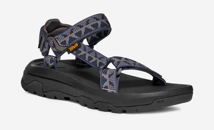 Outdoor sport sandal with navy grey camouflage straps and black sole, side angle view