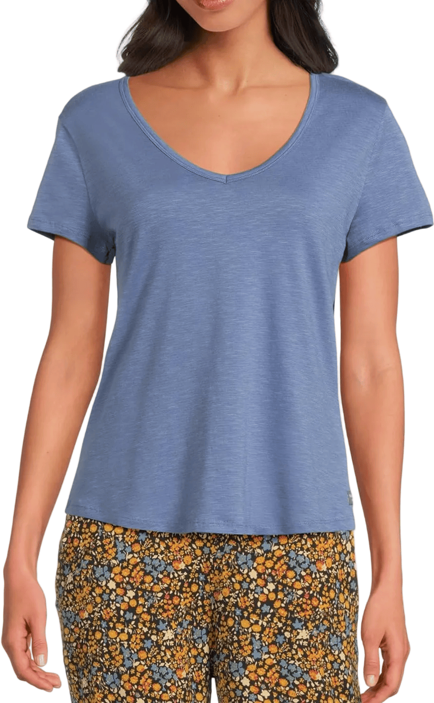 Light blue v-neck short sleeve t-shirt on model with floral pants