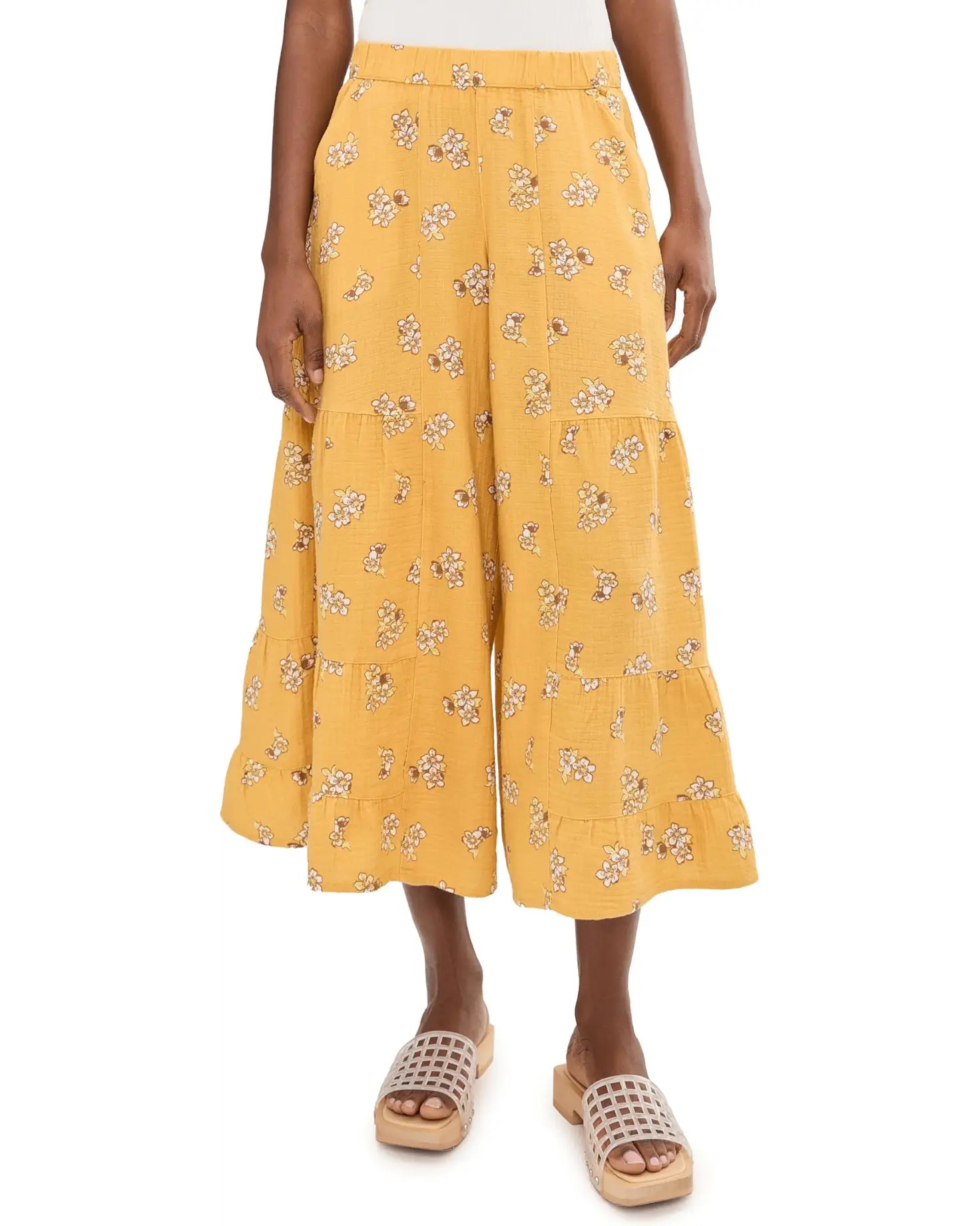 Wide-leg palazzo pants in yellow floral print with tiered ruffles, cropped length