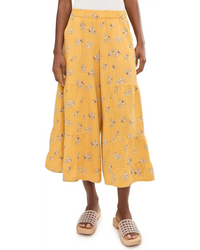 Wide-leg palazzo pants in yellow floral print with tiered ruffles, cropped length