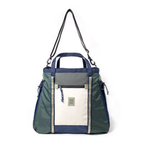 Colorblock tote bag with shoulder strap featuring green, navy, and cream panels