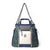 Colorblock tote bag with shoulder strap featuring green, navy, and cream panels