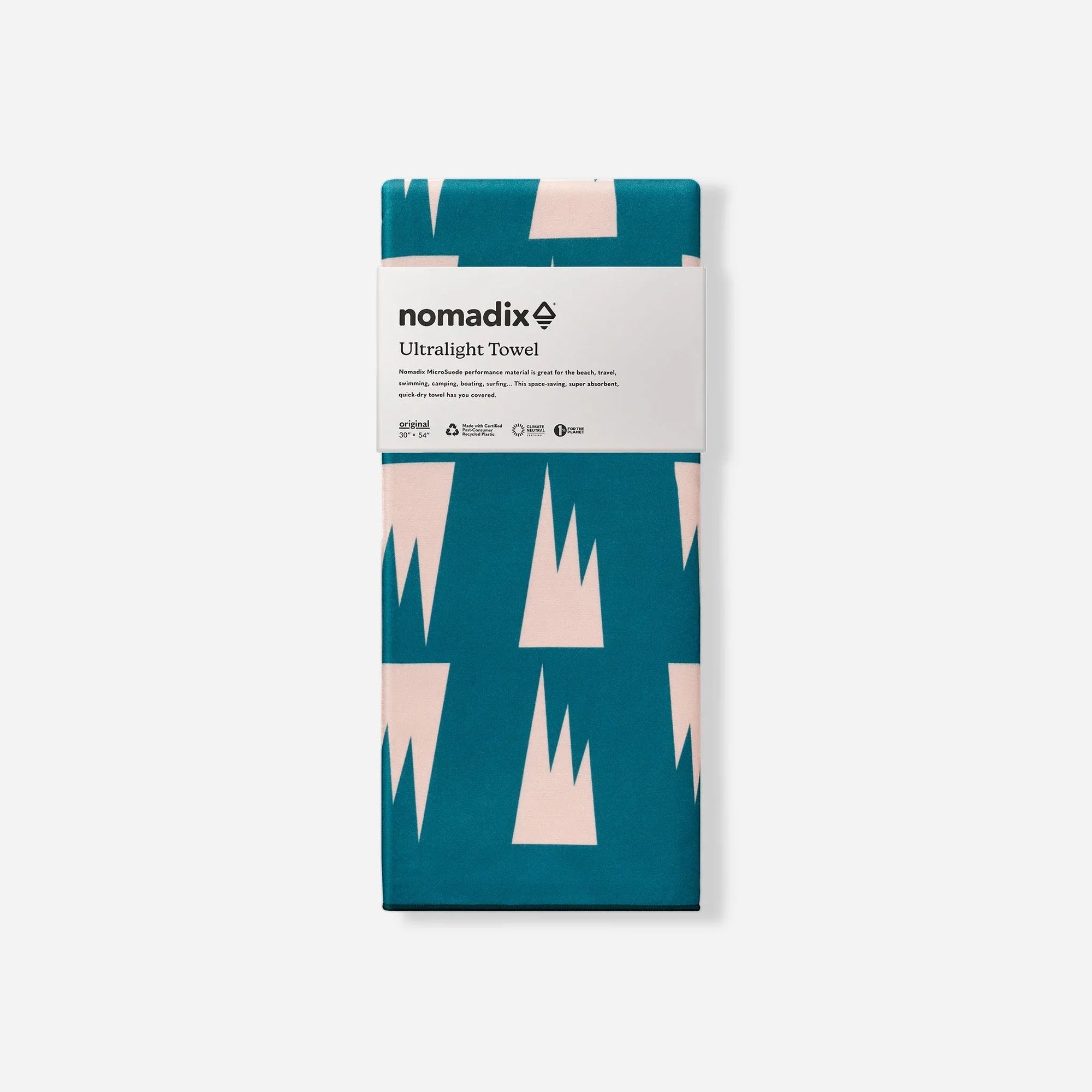 Folded ultralight towel with teal and pink geometric pattern in product packaging