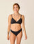 Black reversible bikini bottom shown on model with matching triangle top, front view