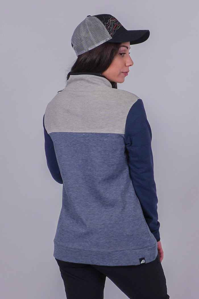 Women's color-block fleece pullover, back view, with gray, dusty blue, and navy panels